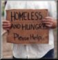 Person holding a homeless sign